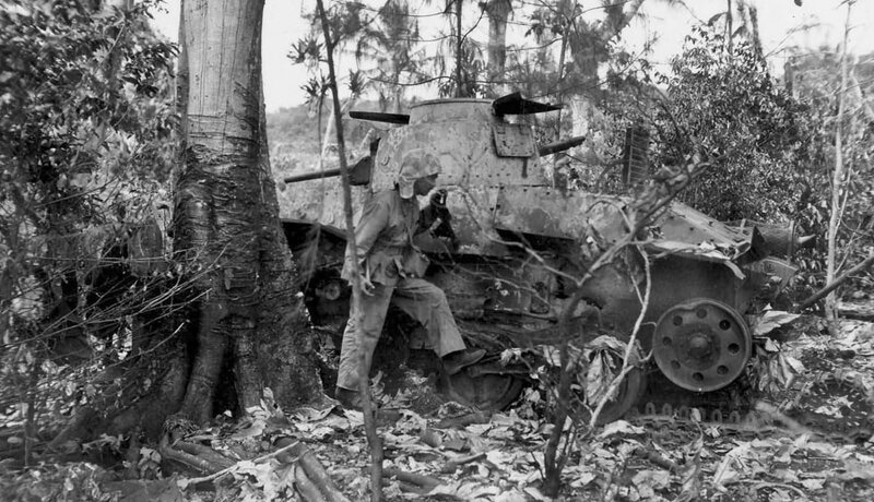 Ha_Go_Light_Tank_blown_off_on_Saipan_1944