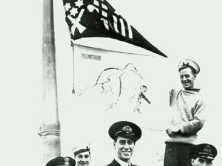 Stork_and_Jolly_Roger_flags_flown_by_HMS
